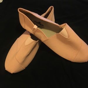 salmon pink slip on sneaker